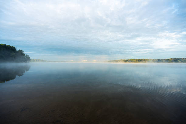Finland lake scape at summer, shore of a lake somewhere in the depths of Finland, a good summer day. Vacation on the lake.