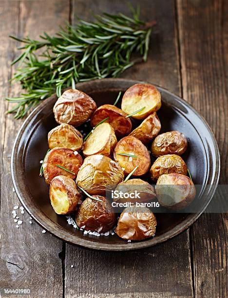 Ovenbaked Potatoes With Sea Salt And Rosemary Stock Photo - Download Image Now - Baked, Baked Potato, Close-up