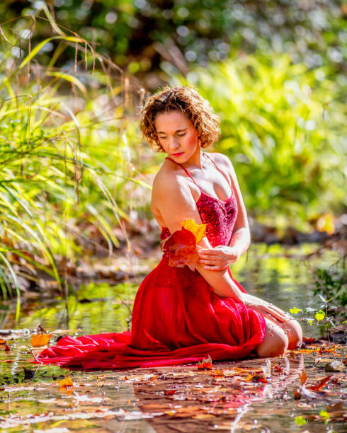 Free Stock Photo of A beautiful young woman posing in a red dress on ...