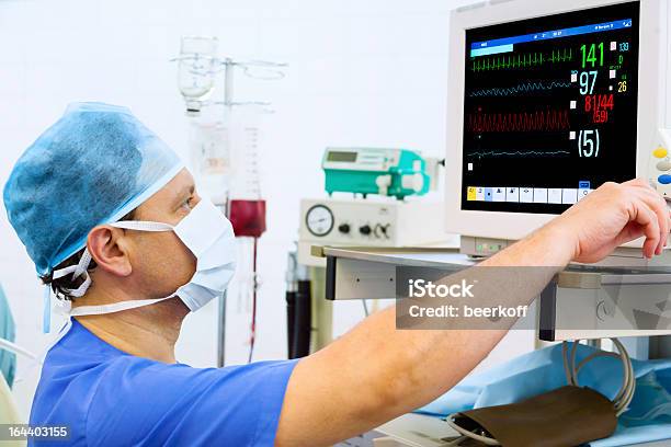 Anaesthesiologist At Monitor In Operation Room Stock Photo - Download Image Now - Anesthesiologist, Surveillance, Anesthetic