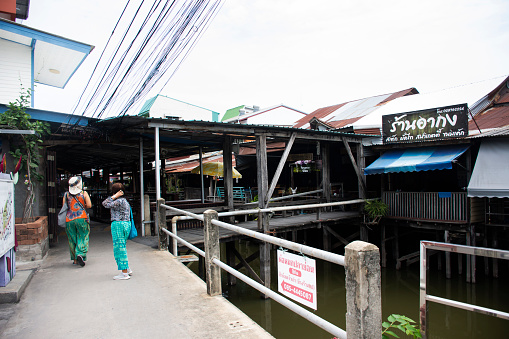 Antique building wooden in bazaar Rahaeng 100 years old market alongside Rahang canal for thai people travelers travel visit shopping at Lat Lum Kaeo city on August 26, 2023 in Pathum Thani, Thailand