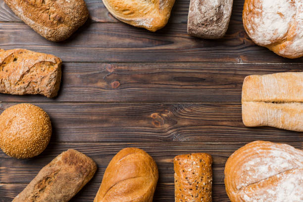 istock Homemade natural breads. Different kinds of fresh bread as background, top view with copy space 1644055628