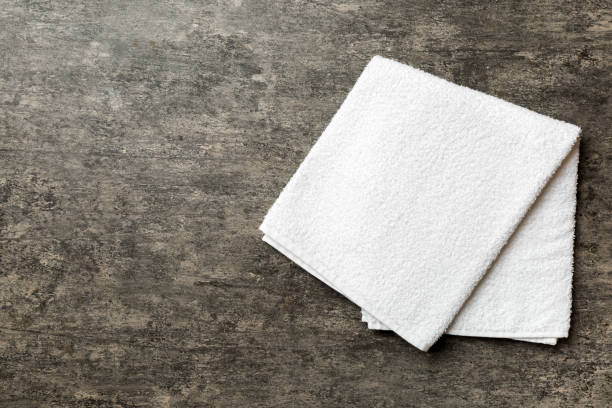 istock Top view of white towels with copy space on colored background 1644055634