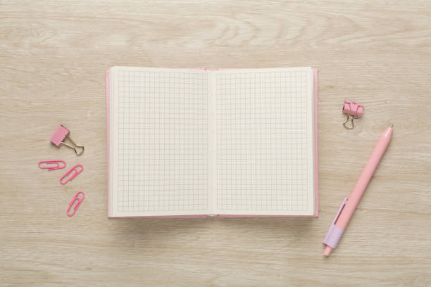 istock Open notebook with stationery on wooden background, top view 1644097570