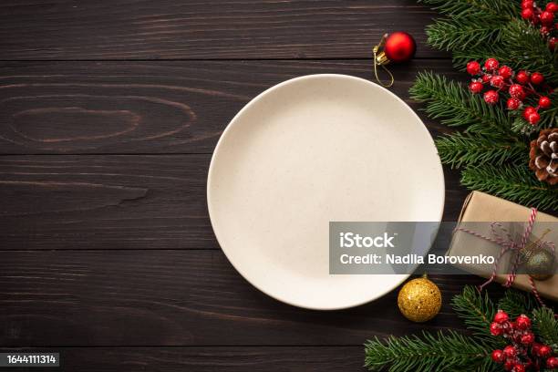 Christmas Table Setting With Plate Cutlery And Christmas Decorations On White Background Stock Photo - Download Image Now