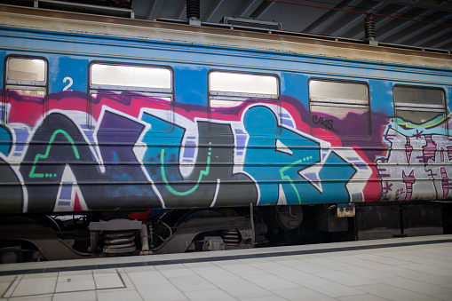 A graffiti-strewn old train passes through the Prokop underground main railway station in Belgrade, Serbia