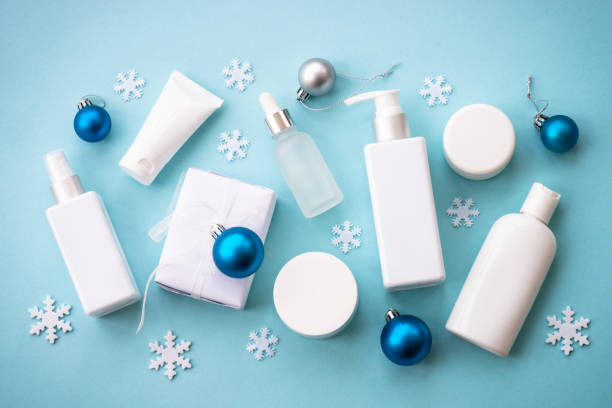 istock Winter cosmetic with holiday decorations on blue. 1644113567