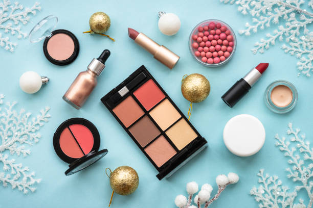 istock Winter cosmetic with holiday decorations on blue. 1644114089