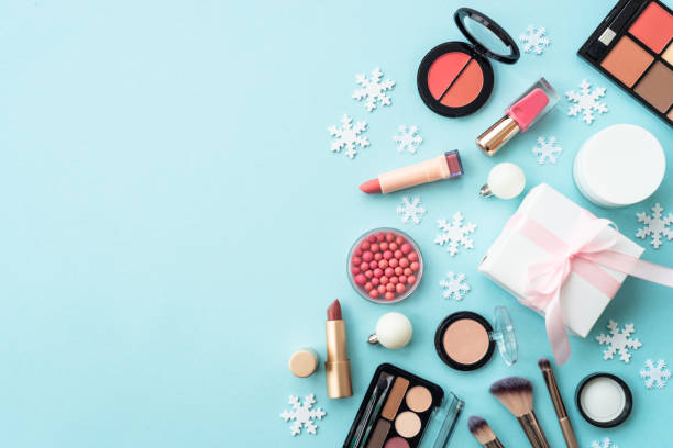 istock Winter cosmetic with holiday decorations on blue. 1644115229