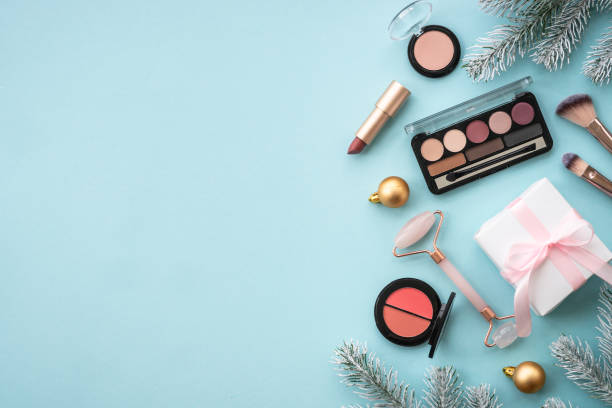 istock Winter cosmetic with holiday decorations on blue. 1644115814