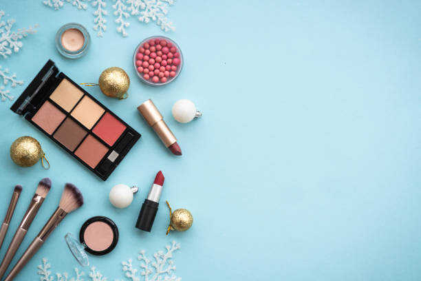 istock Winter cosmetic with holiday decorations on blue. 1644116655