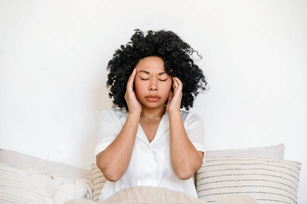istock Afro american woman with headache touching temples 1644117764