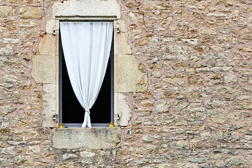 Facade and window in the village of Saint-Front-sur-Lemance, France