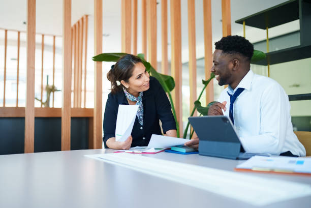 istock Diverse business people on meeting table 1644142889
