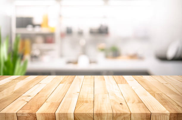 istock Selective focus.Wood table top on blur kitchen counter background.For montage product display or design key visual layout. 1644144556
