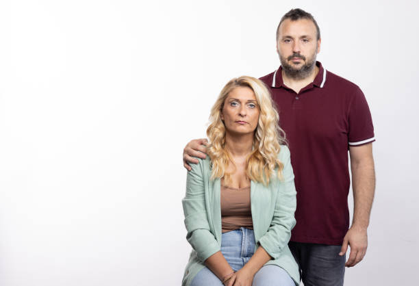 istock White heterosexual couple - studio shot on white background 1644144569