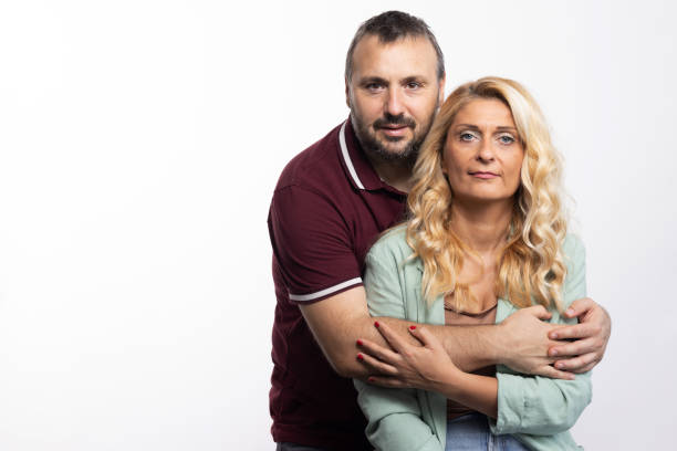 istock White heterosexual couple - studio shot on white background 1644144584