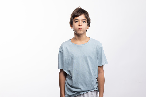 Studio portrait of the teenager wearing blue t shirt