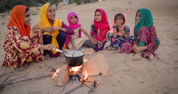 istock Indian children preparing chai - masala tea 1644157220