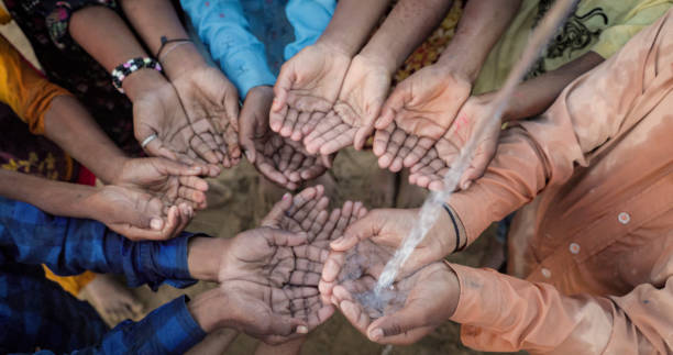 istock Hands of poor - Indian children asking for drinking water 1644160730