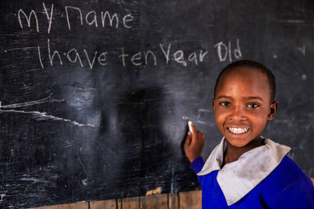istock African young girl is learning English language, Kenya 1644165075