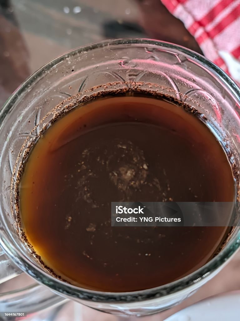 Closeup of a cup of caffeinated black coffee accompanying your break at work Ayurveda Stock Photo