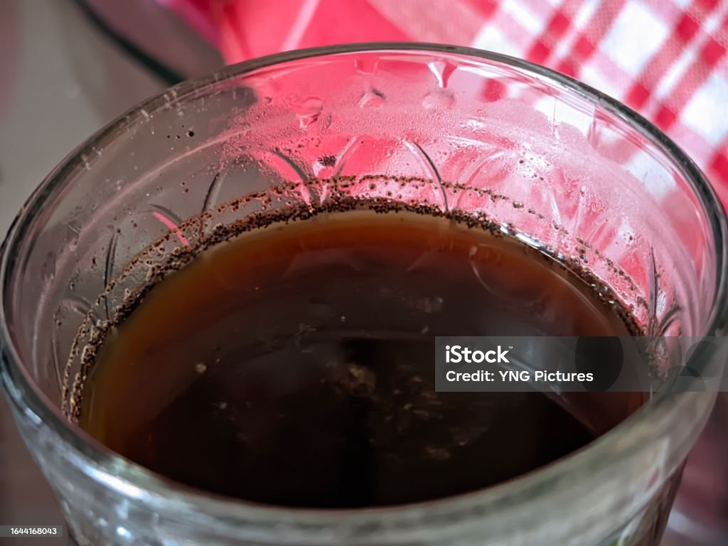 Closeup of a cup of caffeinated black coffee accompanying your break at work Ayurveda Stock Photo