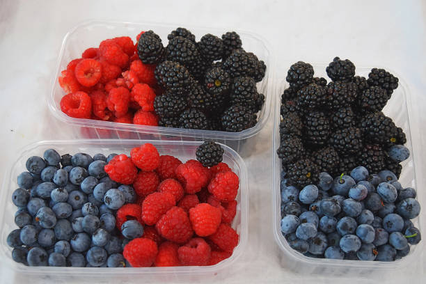 istock Blueberries, raspberries and blackberries in three containers in different combinations at the market in Bratislava. Slovakia. 1644179319