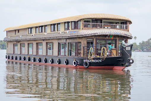 Kochi, Kerala, India-October 9 2022; A Close up picture of a huge Luxury House boat built with wood and coir materials with three star facilities in Kerala backwaters for Eco tourism in Kochi, India.