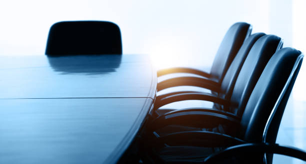 istock Conference table and chairs in empty meeting room 1644192097