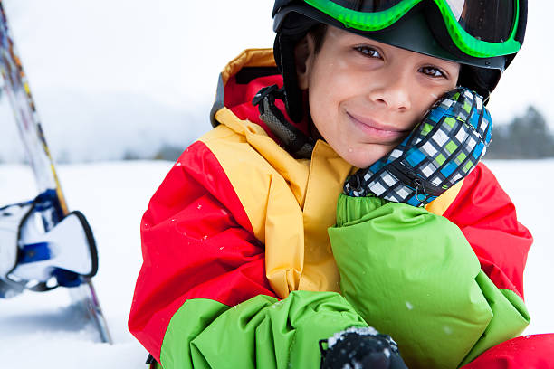 istock Young boy snowboarder portrait 164420225