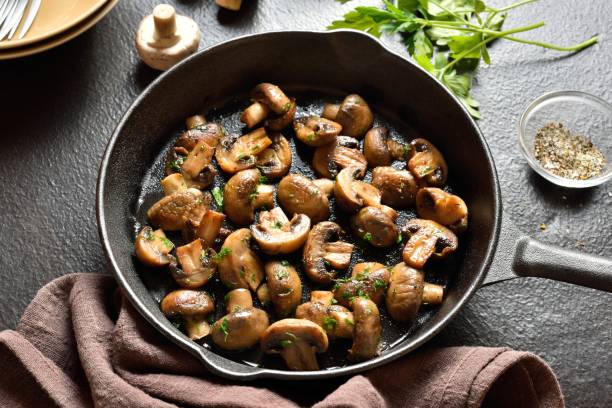istock Roasted mushroom in cast iron pan 1644239124
