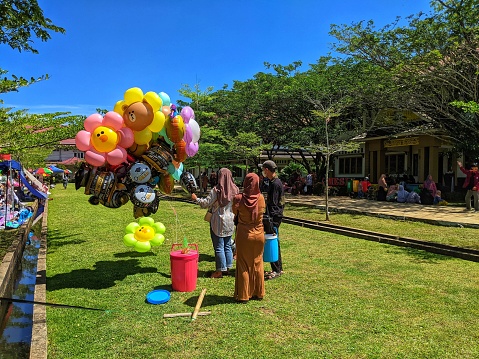 Sambas, Indonesia-30 August 2023: balloon sellers, with large numbers in the open yard