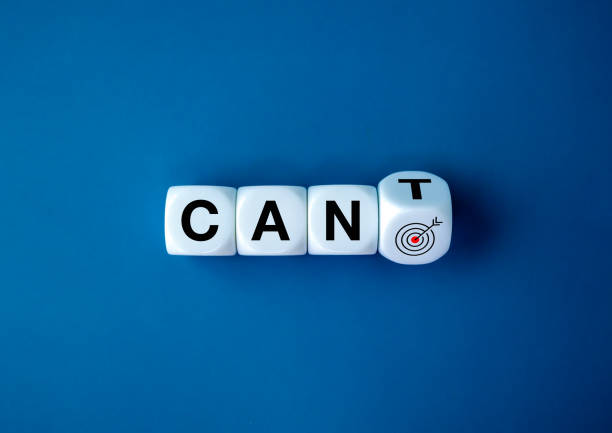 Can or cannot concept. Flipping of text CANT to CAN on white dice cube blocks with target dart icon isolated on blue background, minimalist simple style. I can do, goal success.