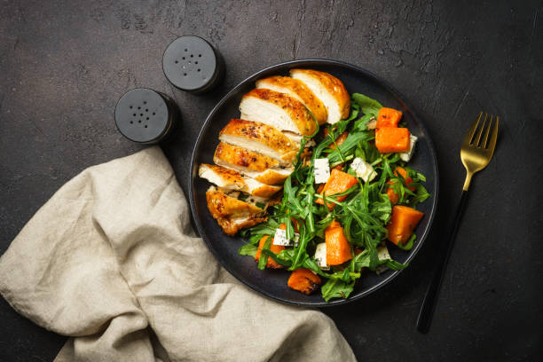 istock Chicken salad with pumpkin and arugula. 1644267960