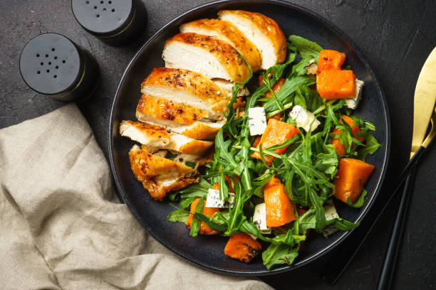 istock Chicken salad with pumpkin and arugula. 1644267961