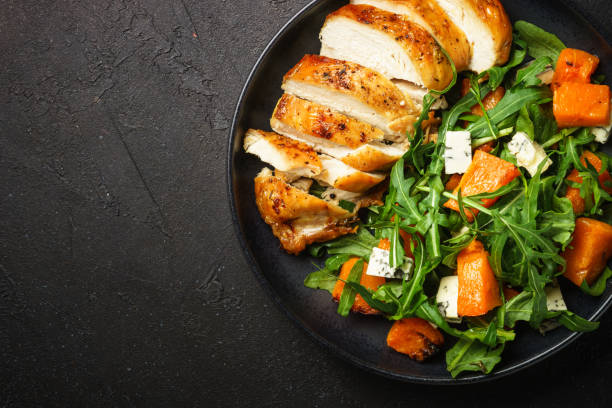 istock Chicken salad with pumpkin and arugula. 1644268081