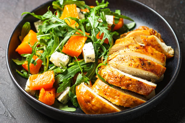 istock Chicken salad with pumpkin and arugula. 1644268487
