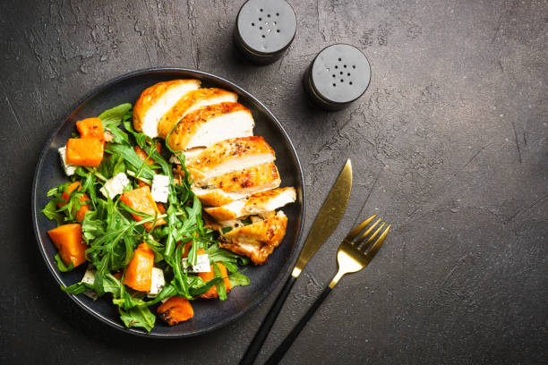 istock Chicken salad with pumpkin and arugula. 1644276971