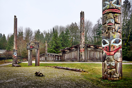 Vancouver, British Columbia, Canada - February 3, 2022. First Nations totem poles, carvings by Northwest Coast First Peoples. Museum of Anthropology, University of British Columbia (UBC)