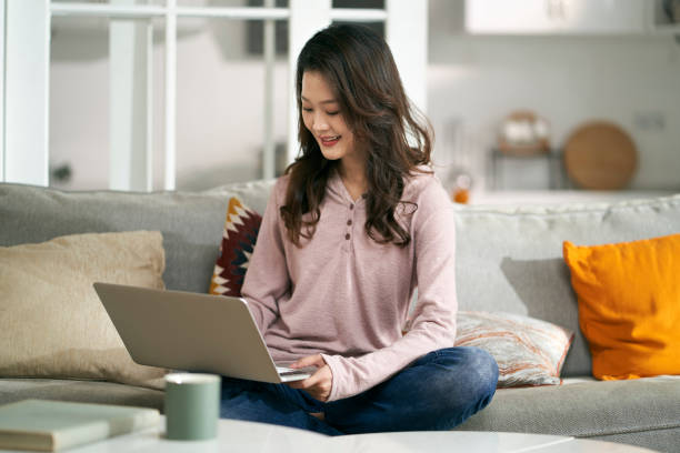 istock young asian professional woman working at home 1644292075
