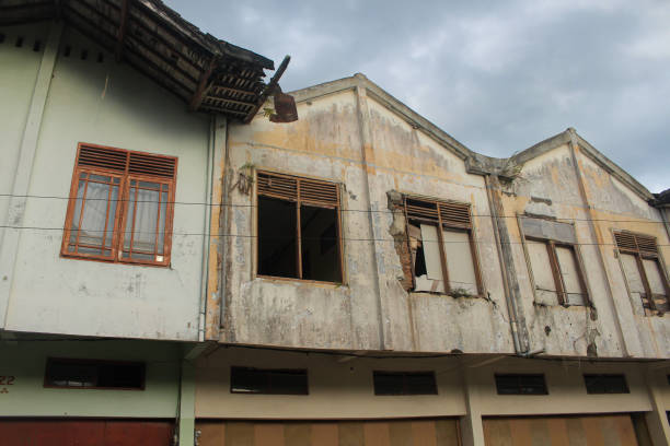 istock damaged and abandoned old shophouse building. 1644294890
