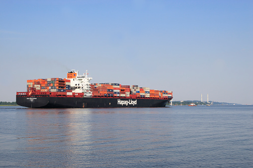 Hamburg, Germany- September 20,2023:Container ship  on the Elbe to Hamburg, at Brunsbuettel, Lower Saxony, Germany, Europe