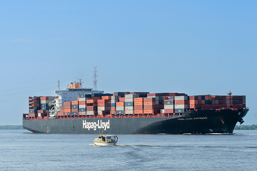 Hamburg, Germany- September 20,2023:Container ship  on the Elbe to Hamburg, at Brunsbuettel, Lower Saxony, Germany, Europe
