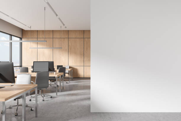 istock Cozy office room interior with chairs and desk with computer and window. Mock up 1644304413