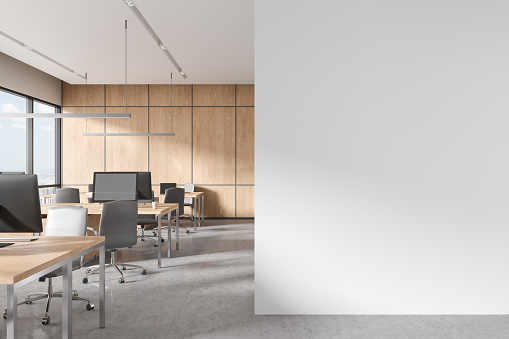 White coworking interior with armchairs and desk with pc computers in row. Panoramic window on New York skyscrapers. Mock up copy space blank partition. 3D rendering