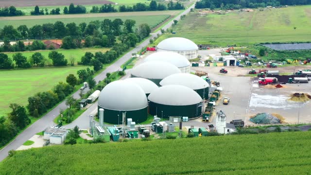 Aerial view of the digesters bulging with methane gas at a large biogas plant in Germany
