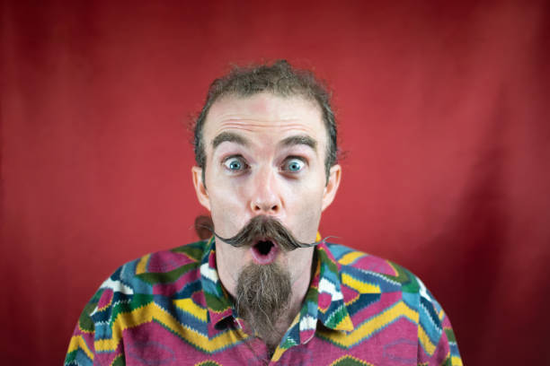 istock Hipster man with mustache, amazed, mouth open and shocked expression like Sales 1644318628