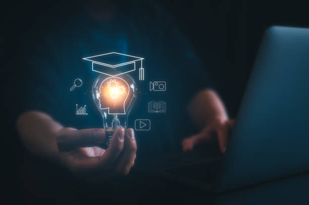 istock Man holding lightbulb showing graduation hat, Internet education course degree, knowledge creative thinking idea problem-solving solution, E-learning graduate certificate program concept 1644319227