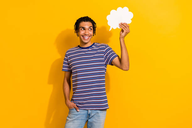 istock Photo of creative funky person look hand hold empty space cloud shape dialogue bubble isolated on yellow color background 1644319659